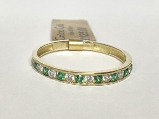 Green and white CZ ring
