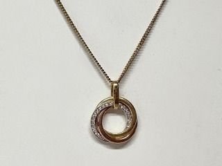 Gold and CZ pendant.