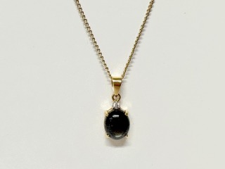 Cats eye and diamond pendant.